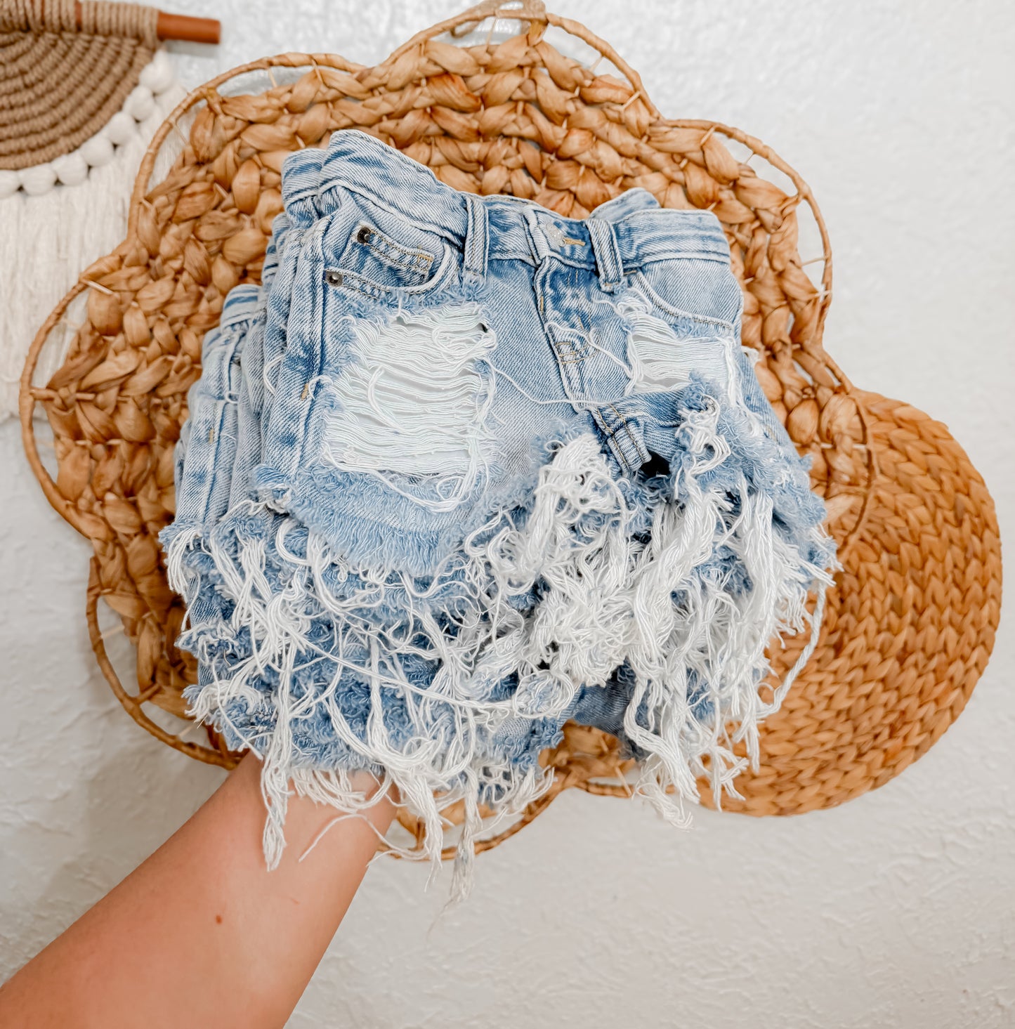 Light wash distressed shorties